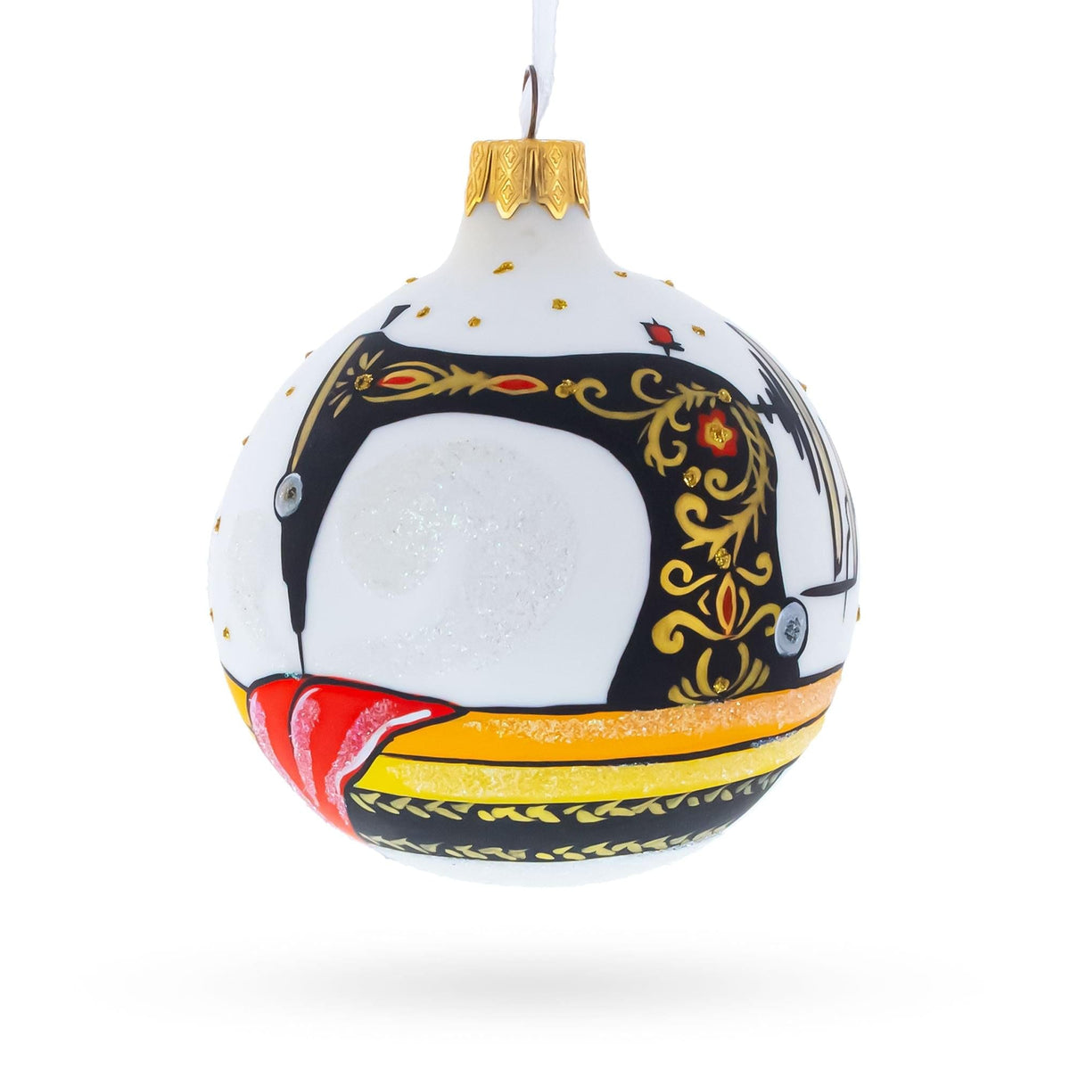 a white and black ornament with a sewing machine on it