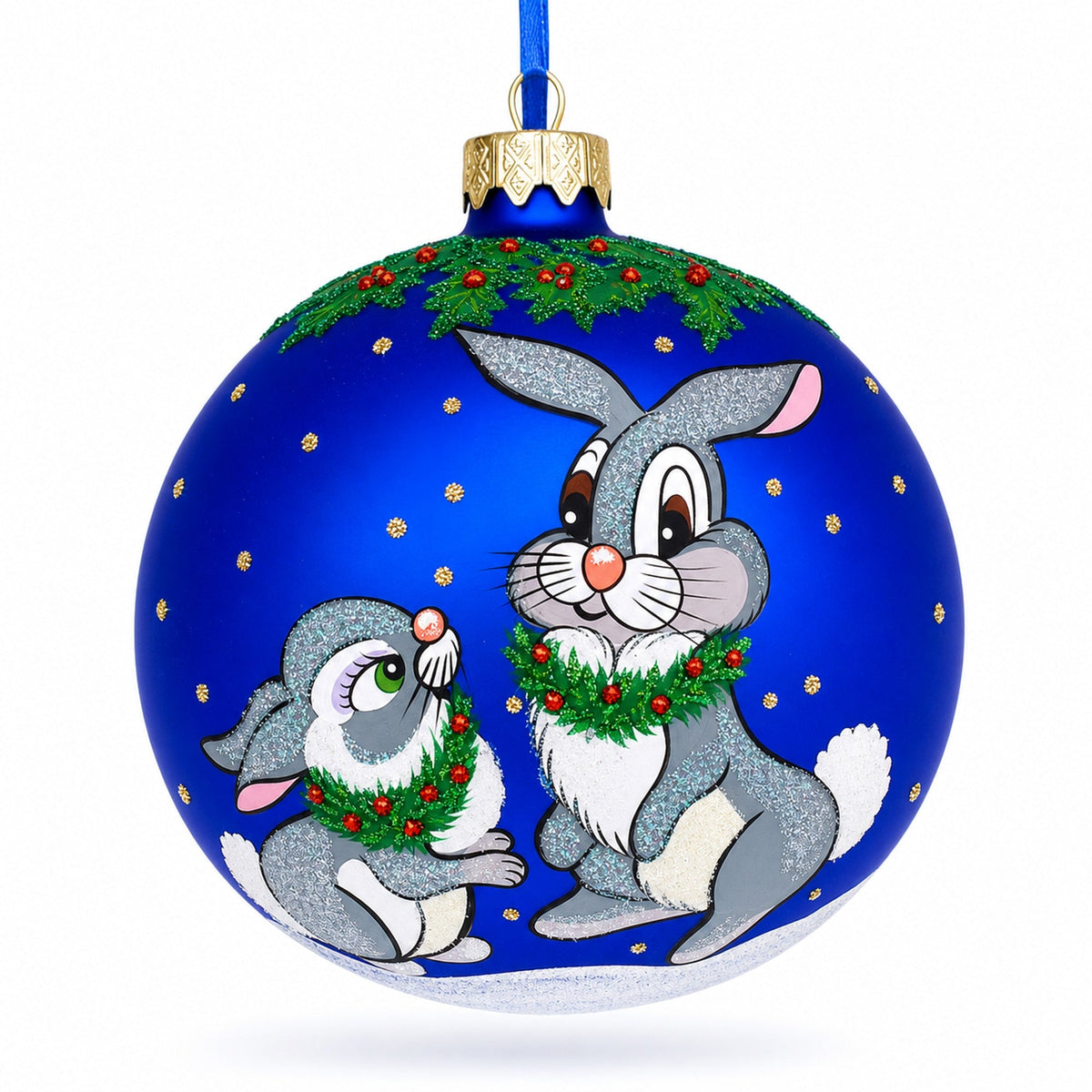 a blue christmas ornament with rabbits painted on it