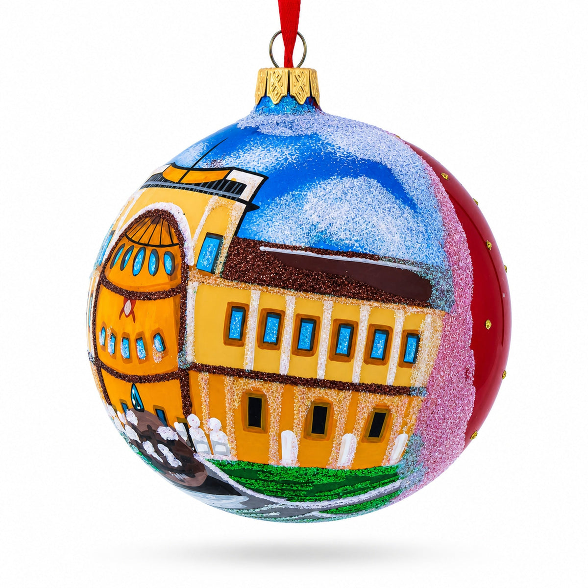 a colorful christmas ornament with a painting of a building