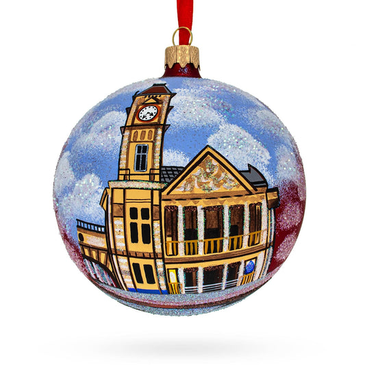 a christmas ornament with a clock tower and building
