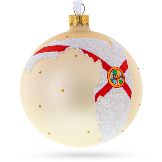 a white and gold christmas ornament