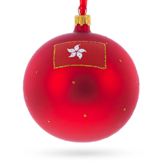a red christmas ornament with a flag