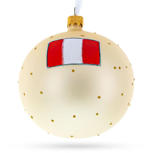 a white and gold christmas ornament
