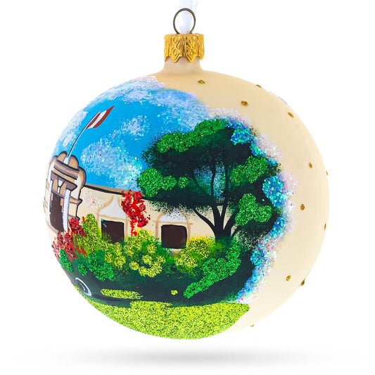 a painted ball with a house and a tree