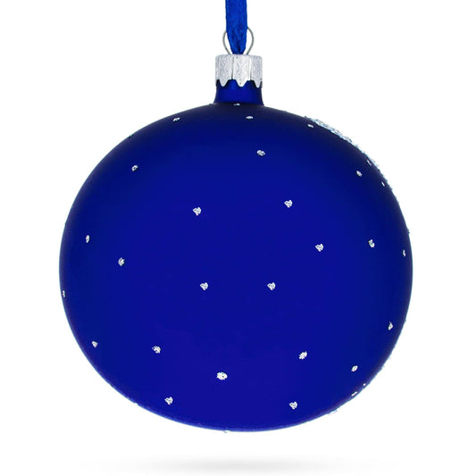 a blue christmas ornament with white dots