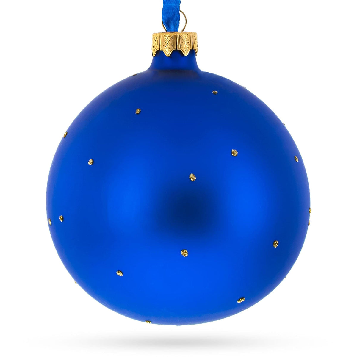 a blue christmas ornament with gold dots