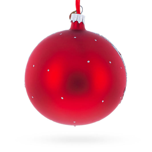 a red christmas ornament from a red ribbon