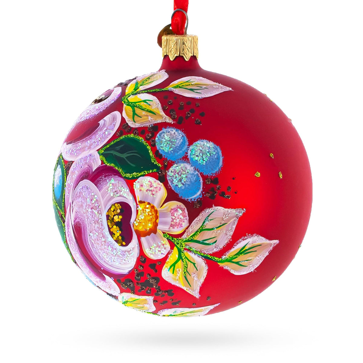 a red christmas ornament with a painted flower