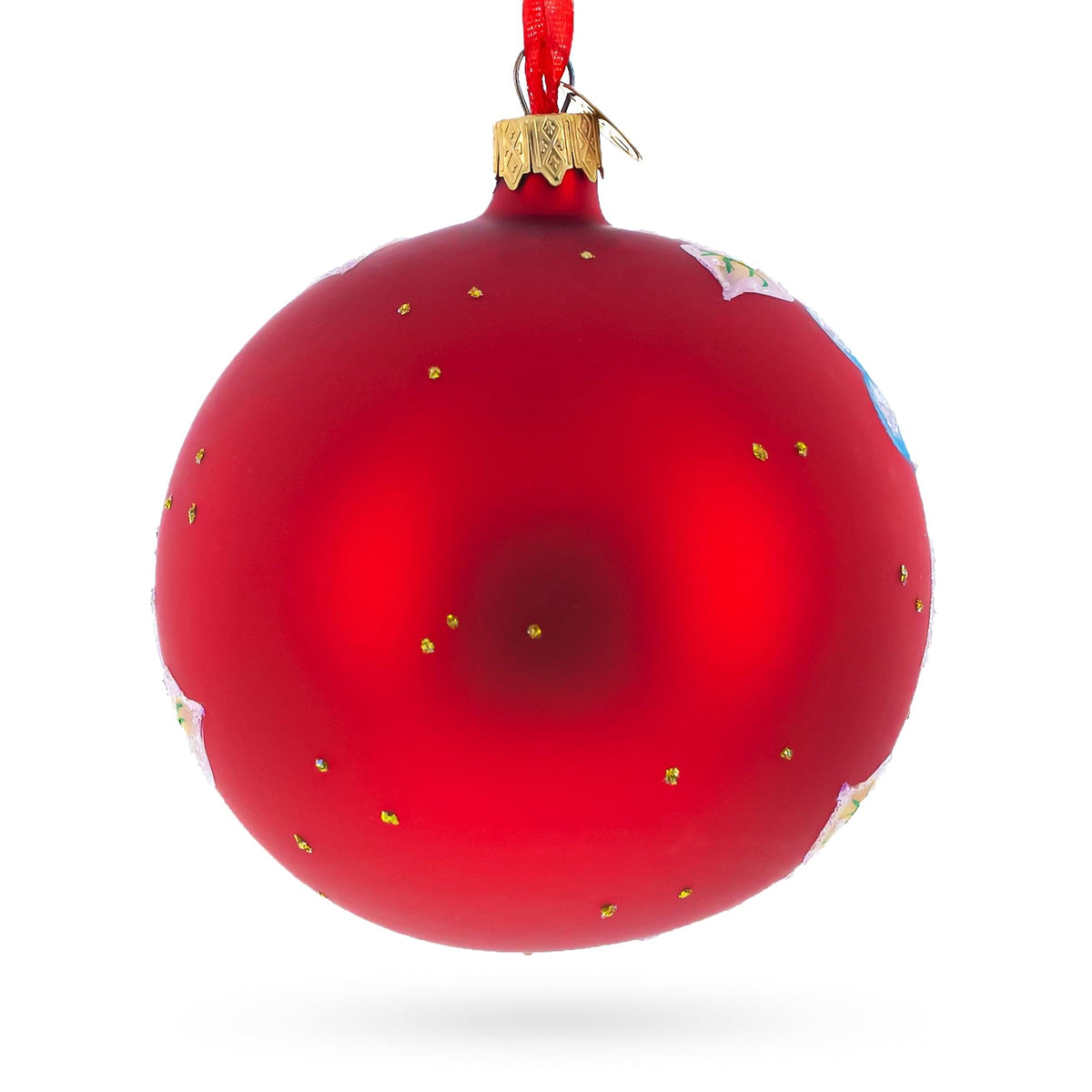 a red christmas ornament with gold dots
