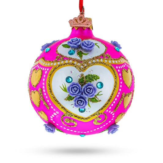 a pink and gold christmas ornament