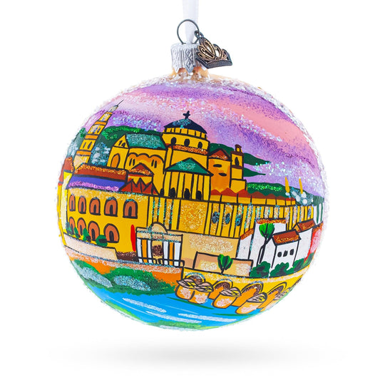 a colorful christmas ornament with a city painted on it