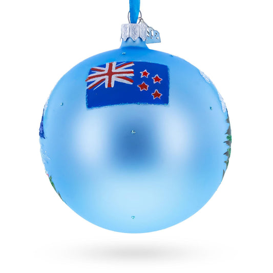 a blue christmas ornament with a flag