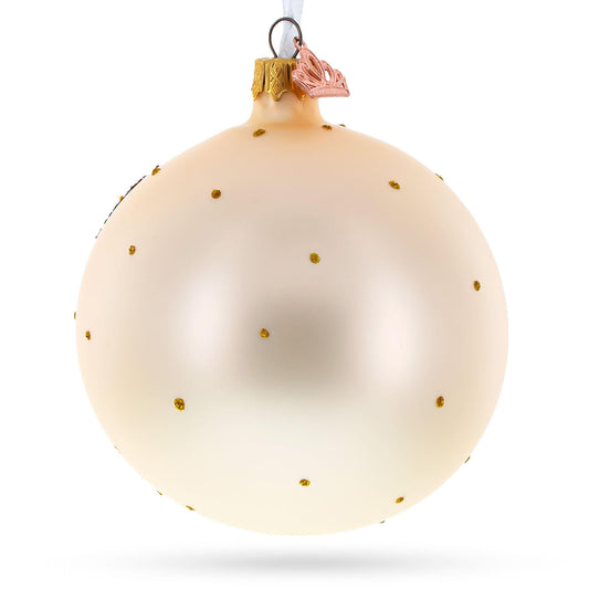 a white and gold christmas ornament