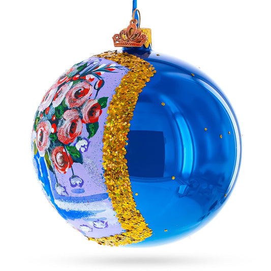 a blue christmas ornament with a crown