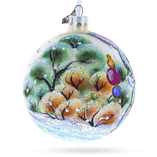 a christmas ornament with a painting on it