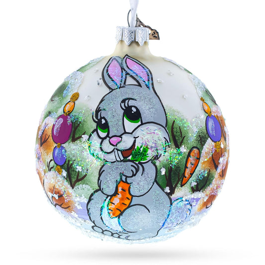 a christmas ornament with a rabbit painted on it