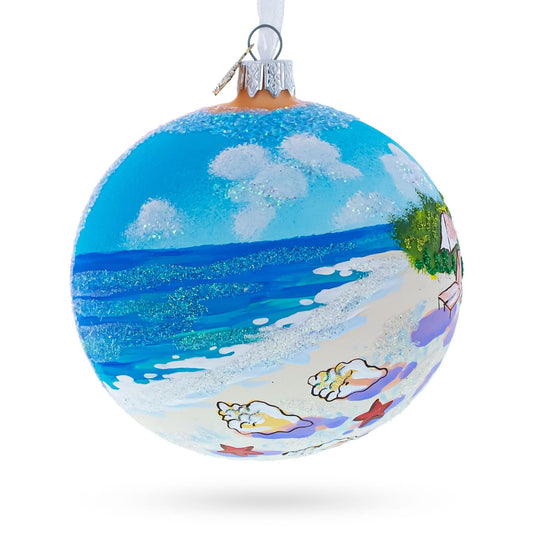 a blue and white ornament with a beach and a white background