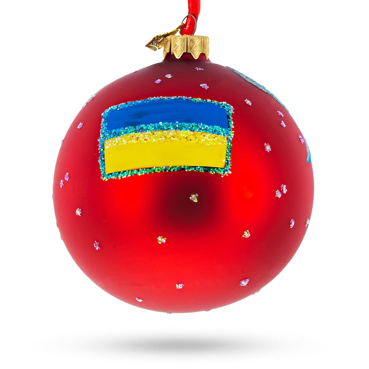 a red christmas ornament with a flag painted on it