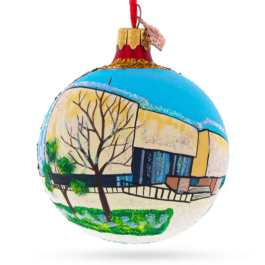 a colorful christmas ornament with a painting on it