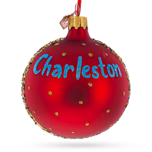 a red christmas ornament with blue text