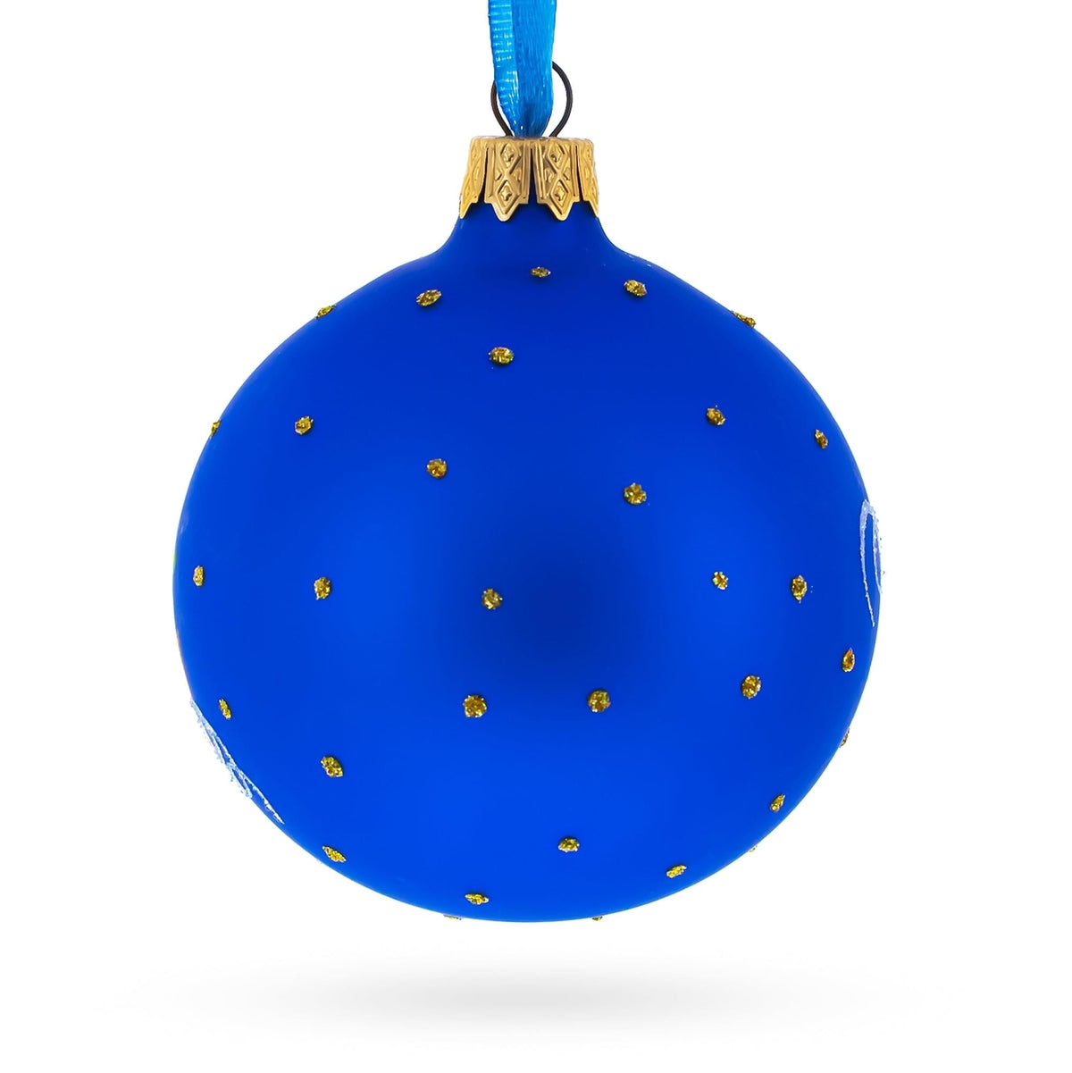 a blue christmas ornament with gold dots