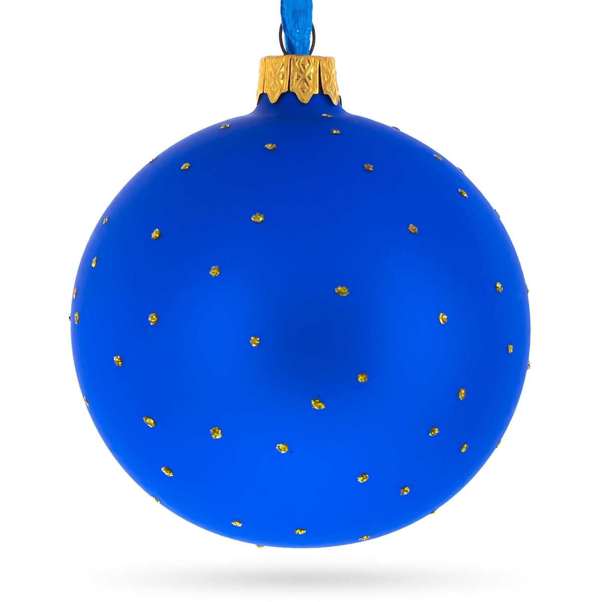 a blue christmas ornament with gold dots