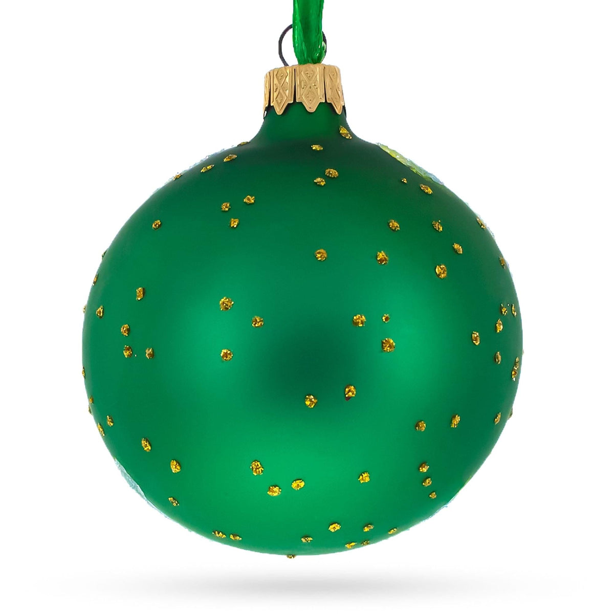a green and gold christmas ornament