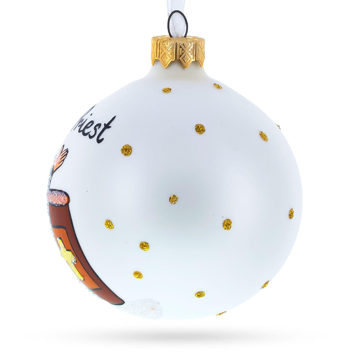 a white christmas ornament with gold dots