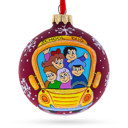 a christmas ornament with a picture of a school bus