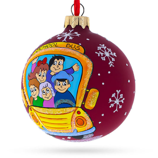a christmas ornament with a picture of a school bus