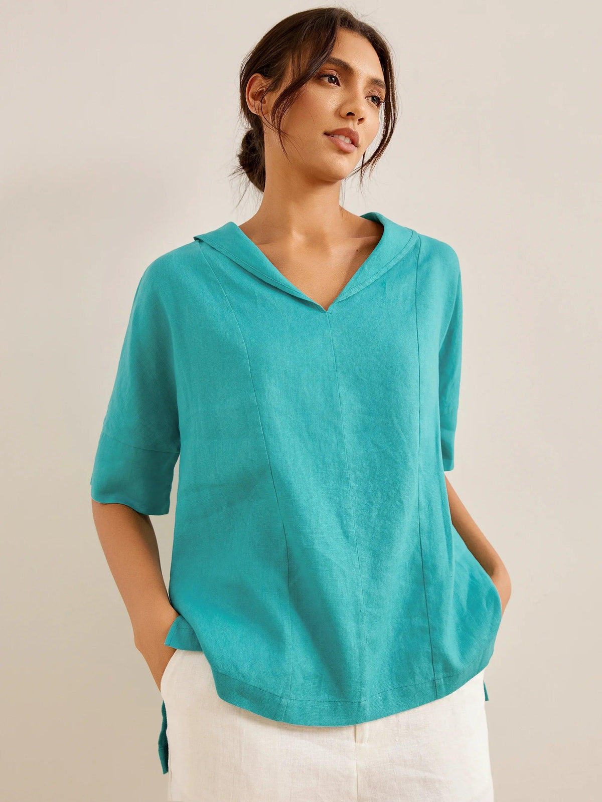 a woman in a blue shirt