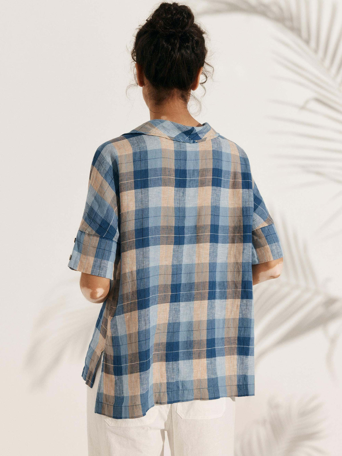 a woman in a plaid shirt