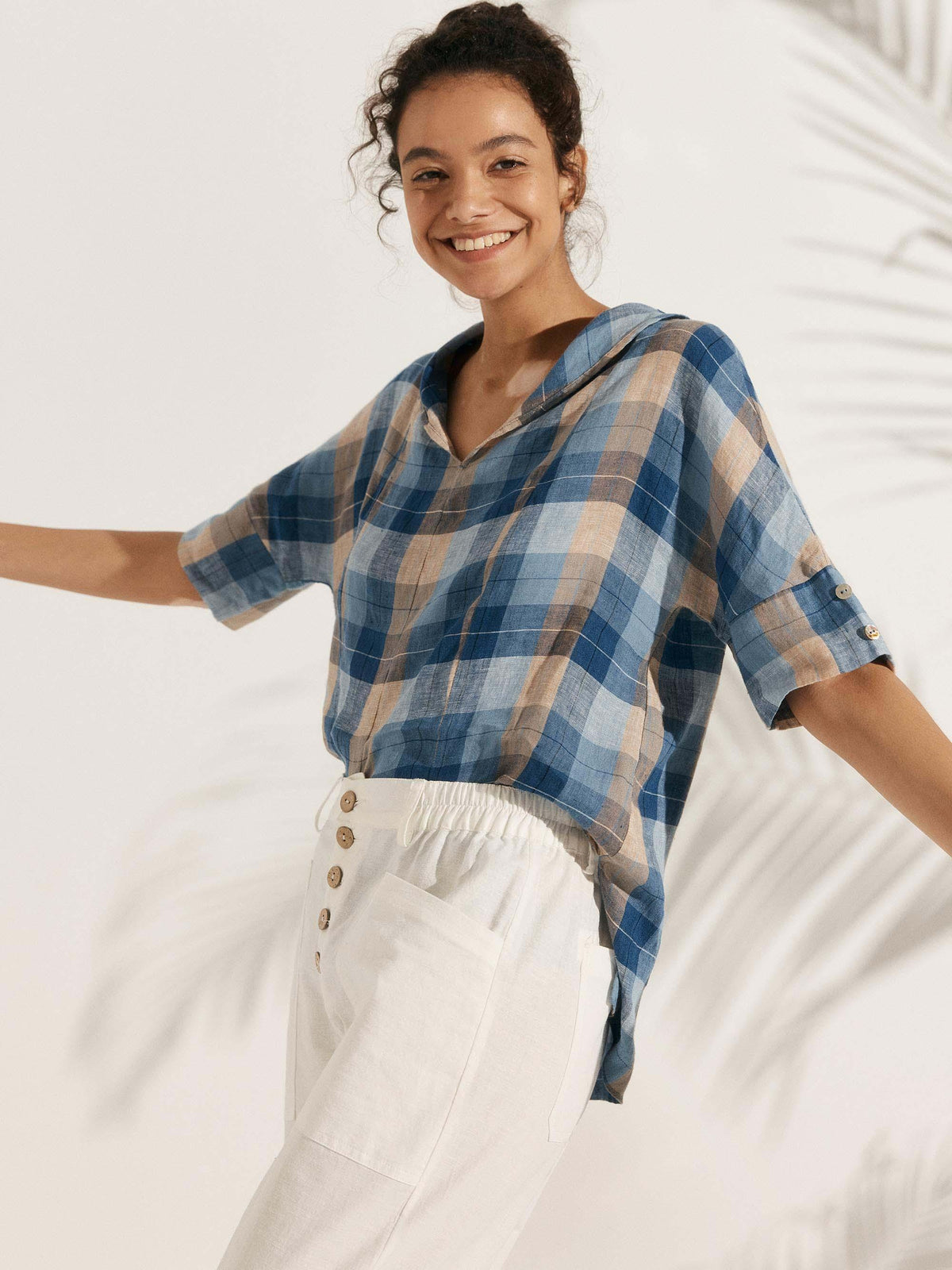 a woman smiling with her arms out