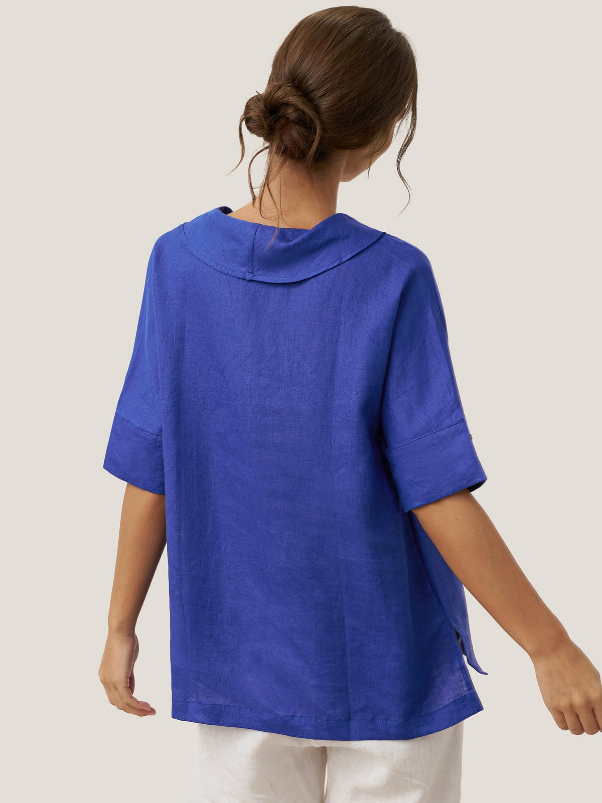 a woman in a blue shirt