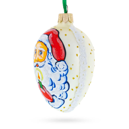 Santa Holding Candle Glass Egg Ornament 4 Inches