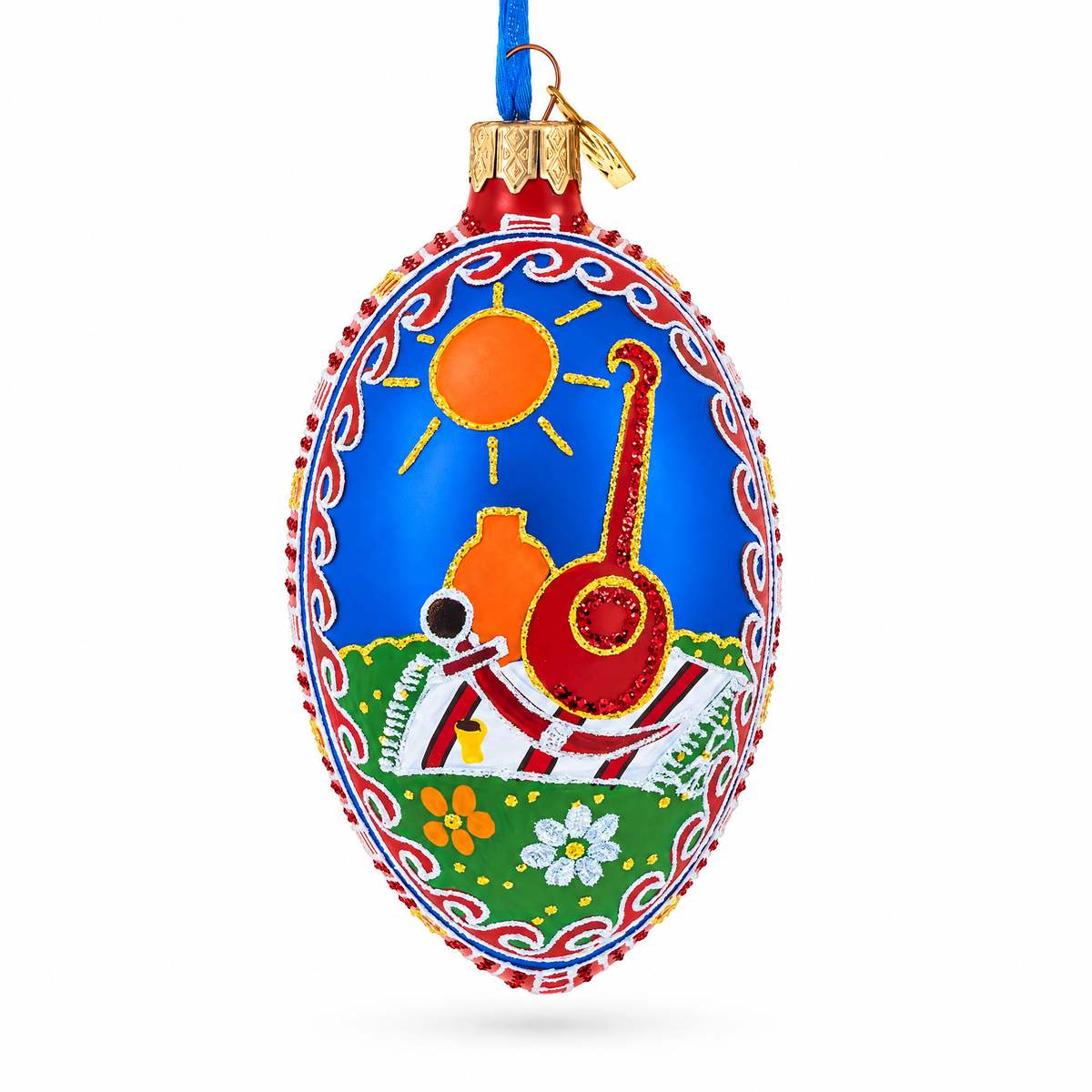 a blue and red ornament with a picture of a motorcycle and sun