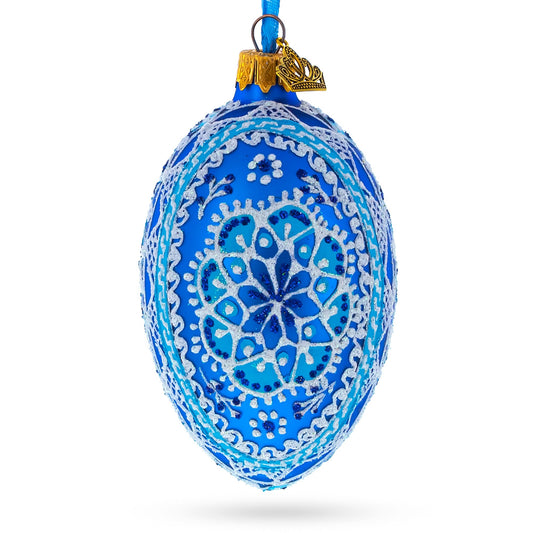 a blue and white decorated christmas ornament
