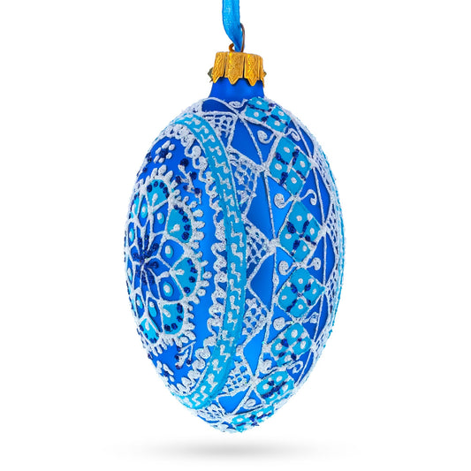 a blue and white decorated christmas ornament