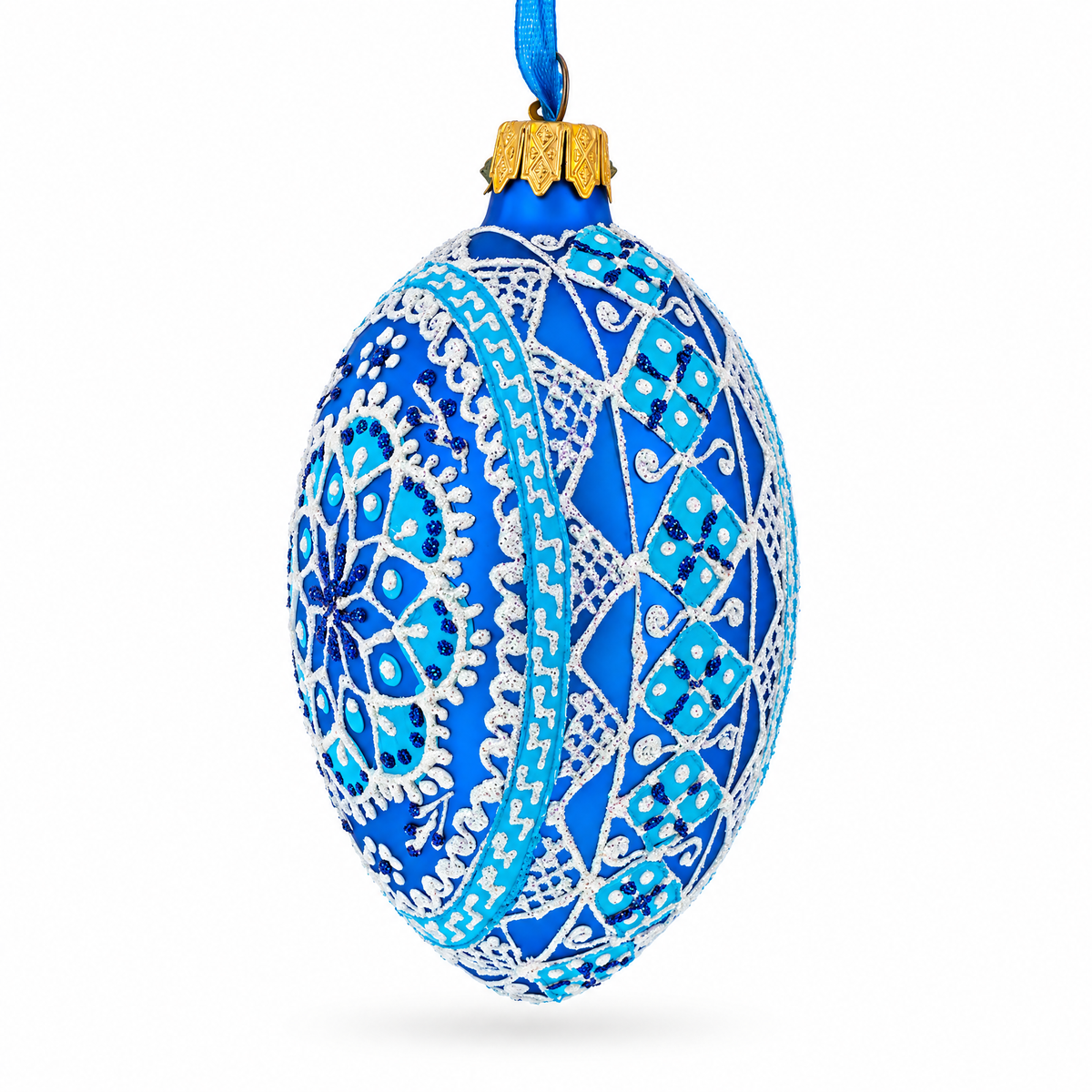 a blue and white decorated christmas ornament