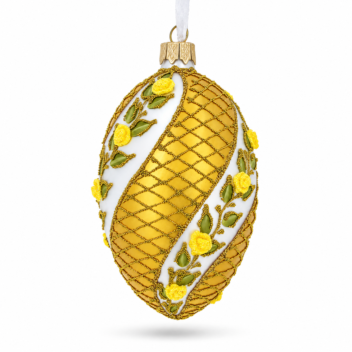 a gold and white decorated egg