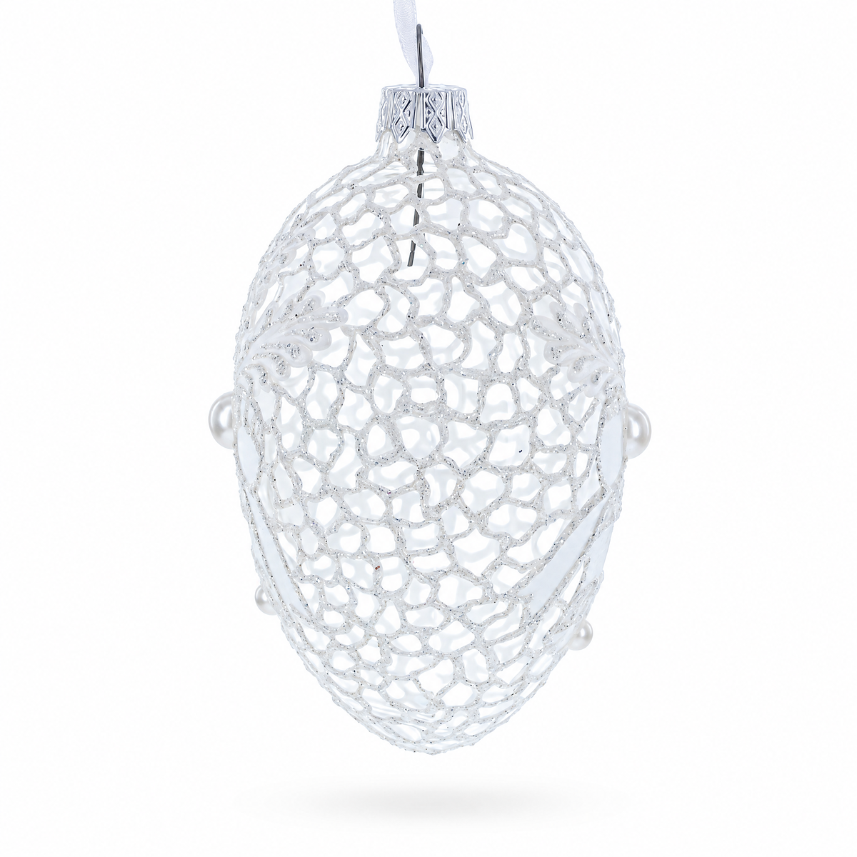 a silver ornament with pearls