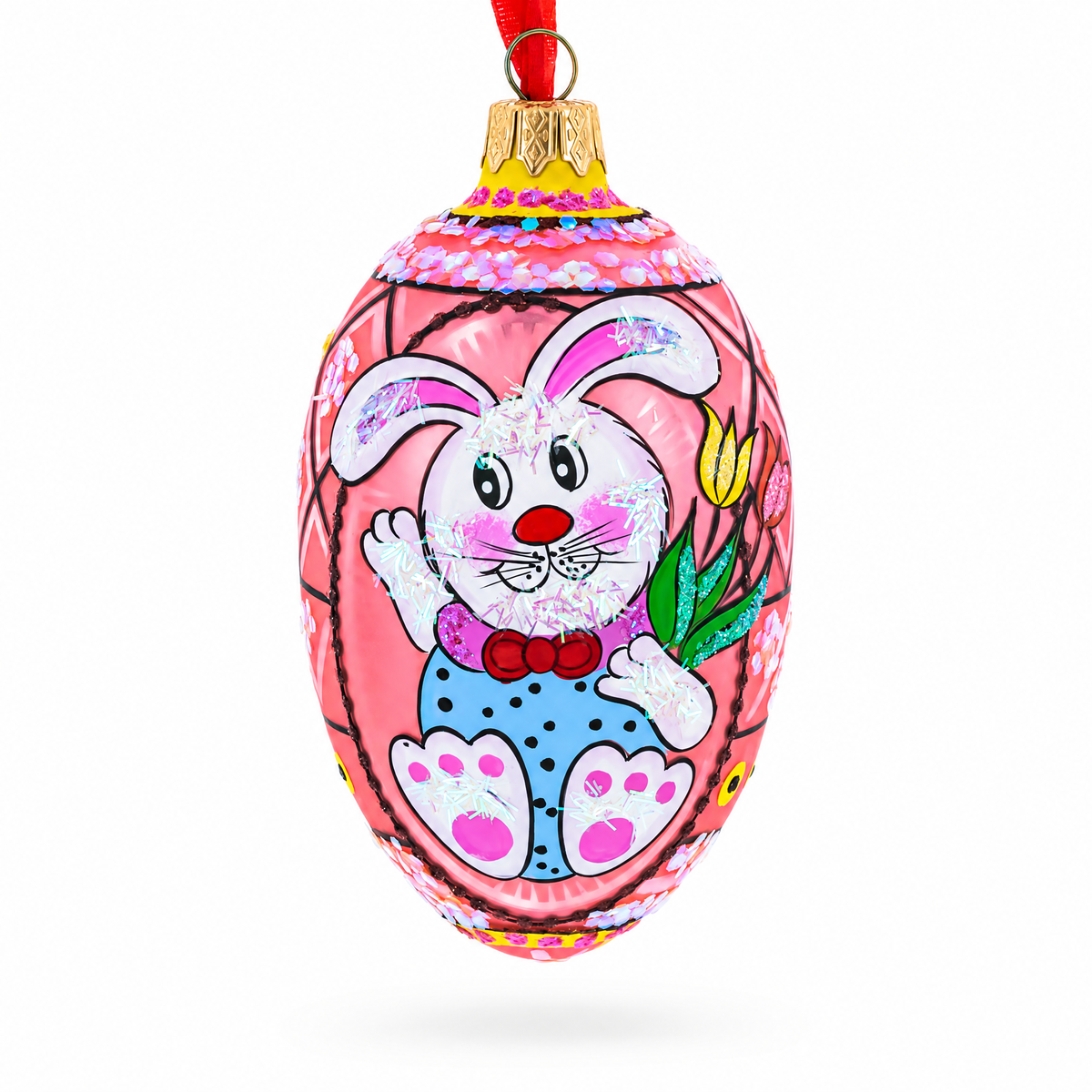 a pink egg shaped ornament with a rabbit painted on it