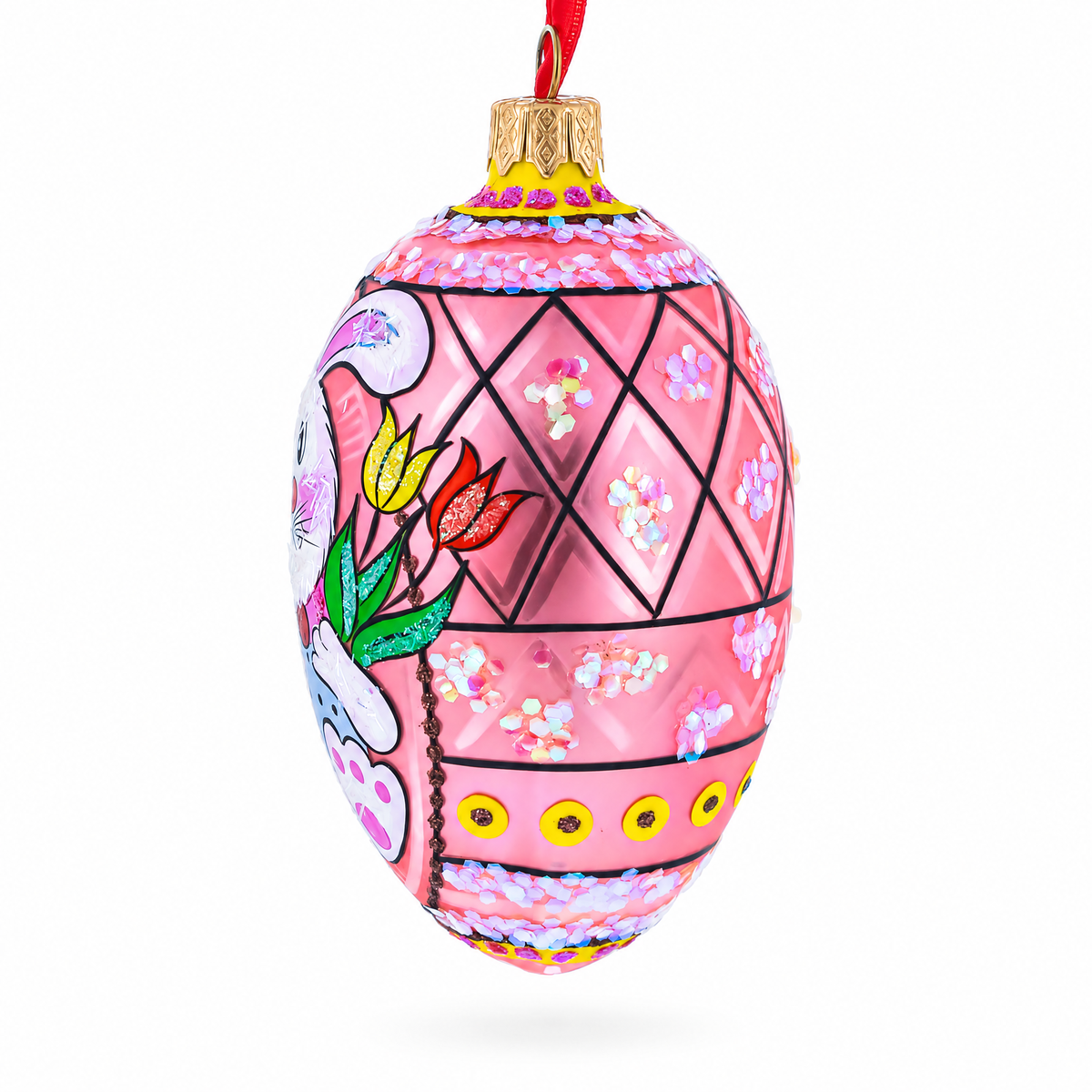 a pink ornament with a design on it