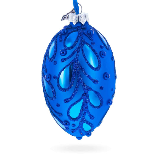 a blue ornament with glitter