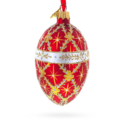 a red and gold decorated egg shaped christmas ornament