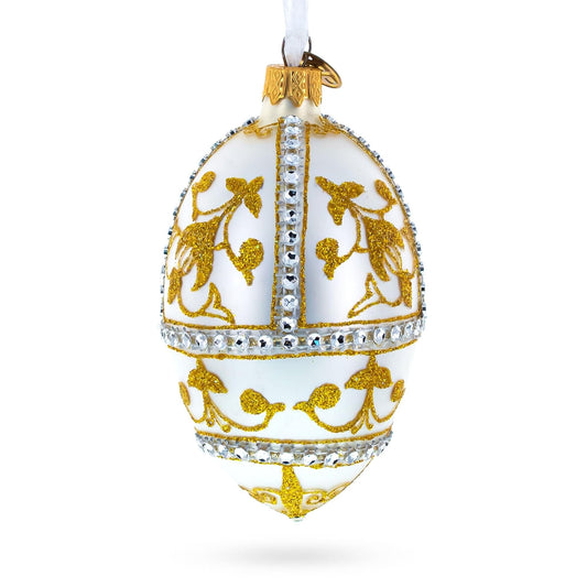 a white and gold decorated egg