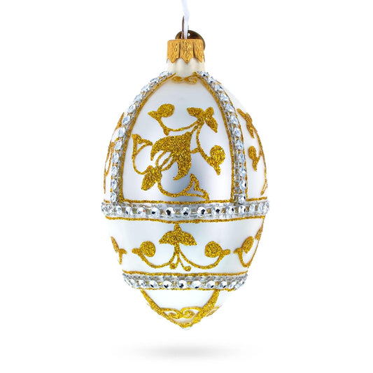a white and gold decorated egg