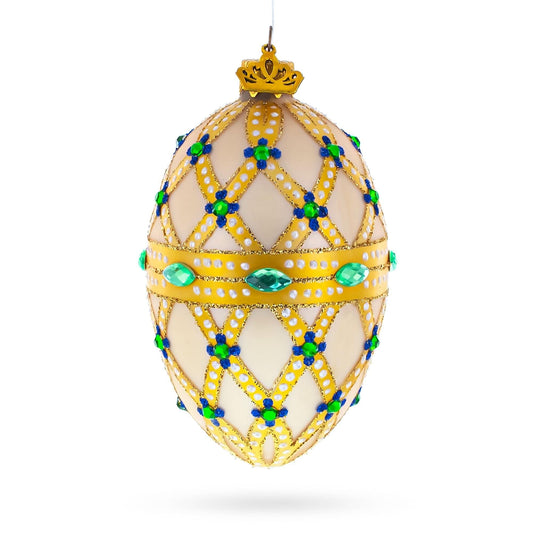 a decorated egg with blue and green gems