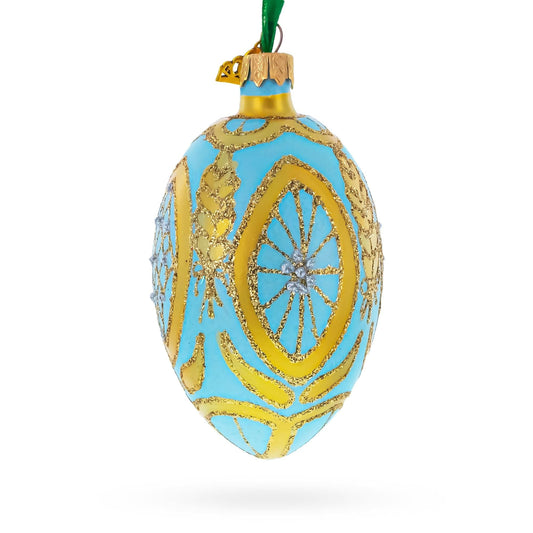 a blue and gold decorated egg ornament