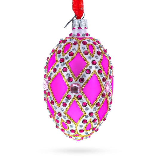 a pink and gold decorated egg shaped christmas ornament